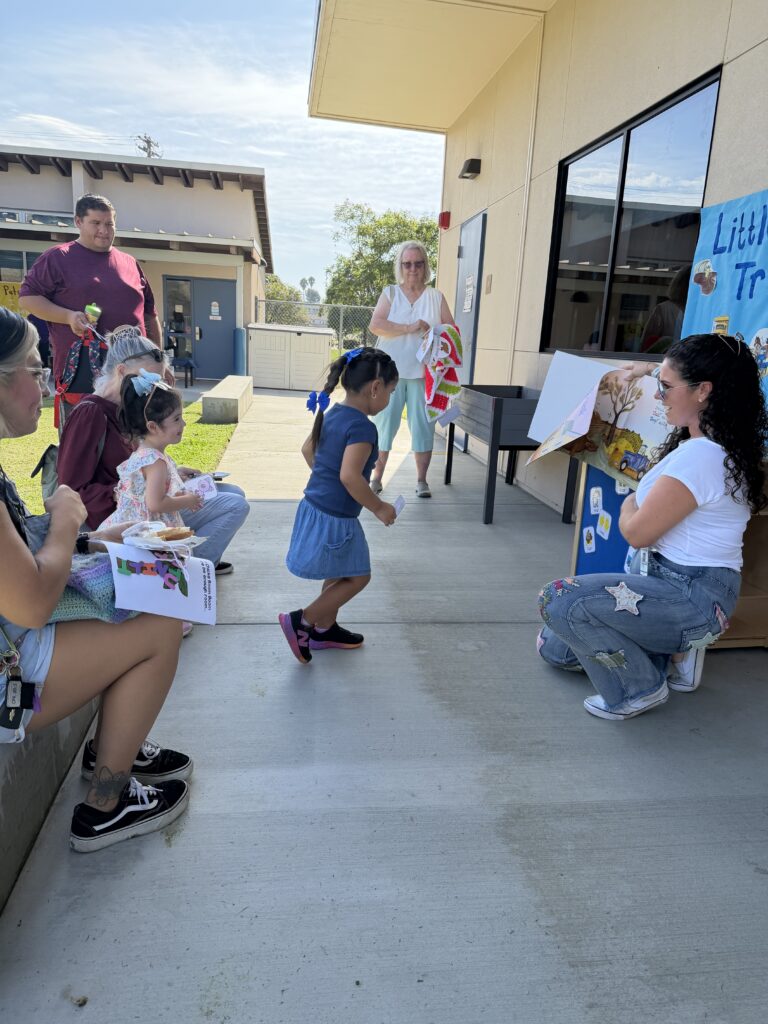 Parent Reading Book to students