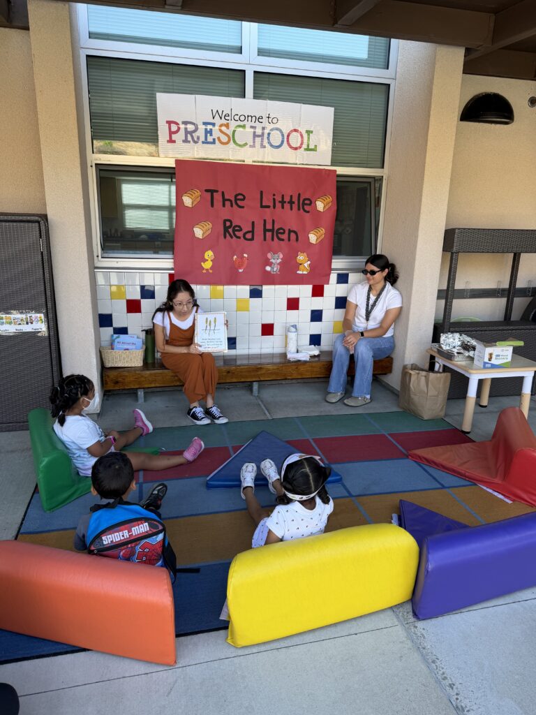 Parent Reading Book to students