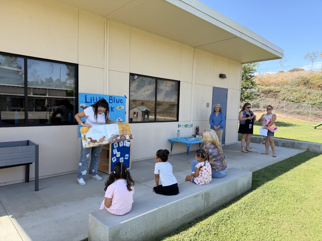 Parent Reading Book to students