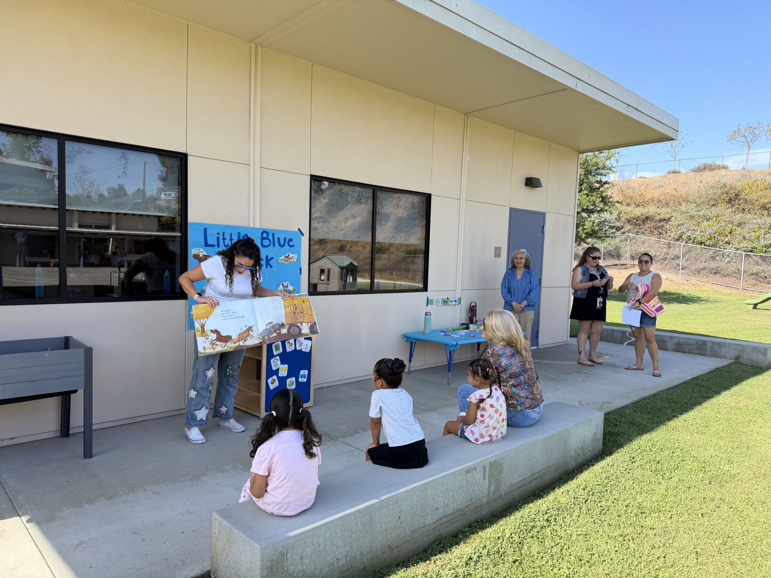 Parent Reading Book to students